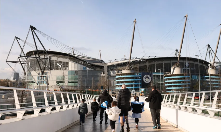 Manchester City midfielders in action during a pre-season match at the Etihad Stadium